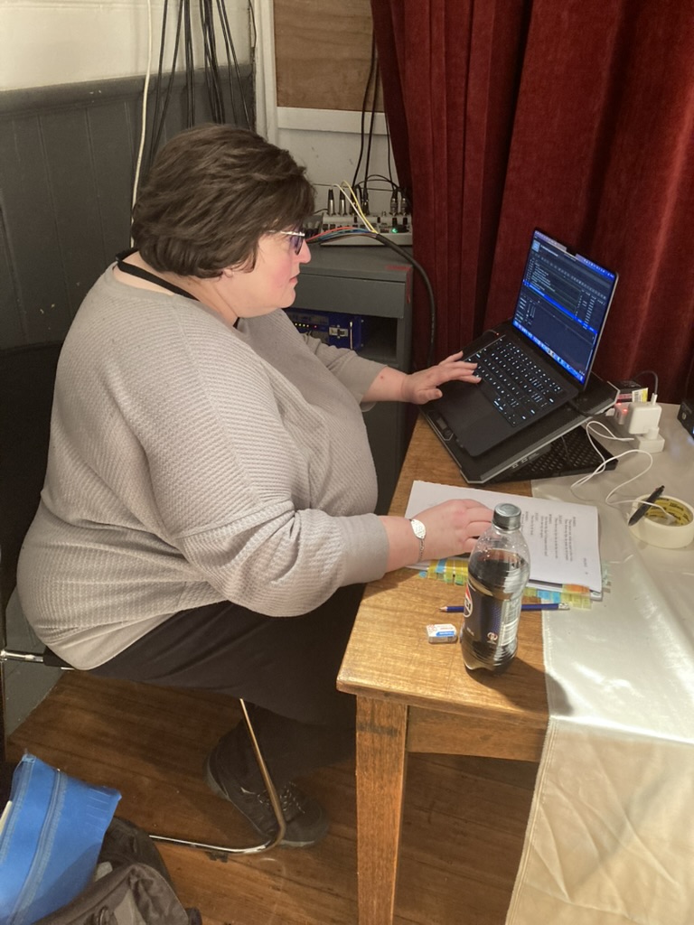 Amanda Sutherland operating sound and lights for A Tender Thing