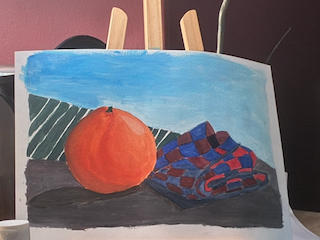 Early still life painting exercise featuring an orange and patterned fabric